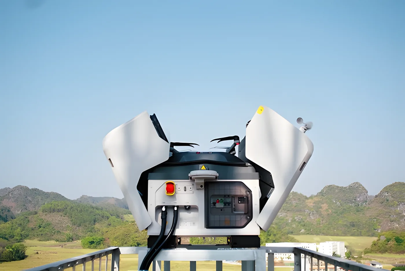 Remote base open on a raised structure, with the site landscape behind.
