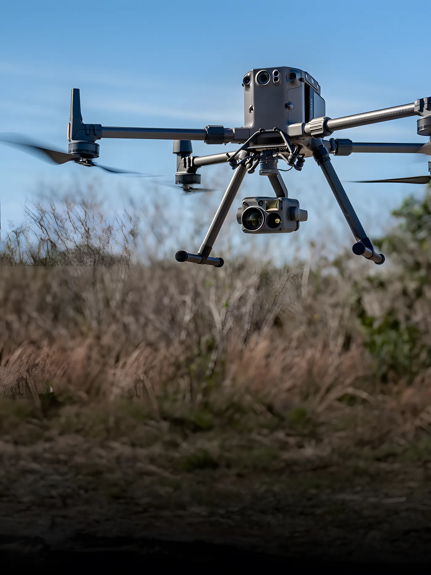 Aerial patrol over an area of dense vegetation inside the perimeter.